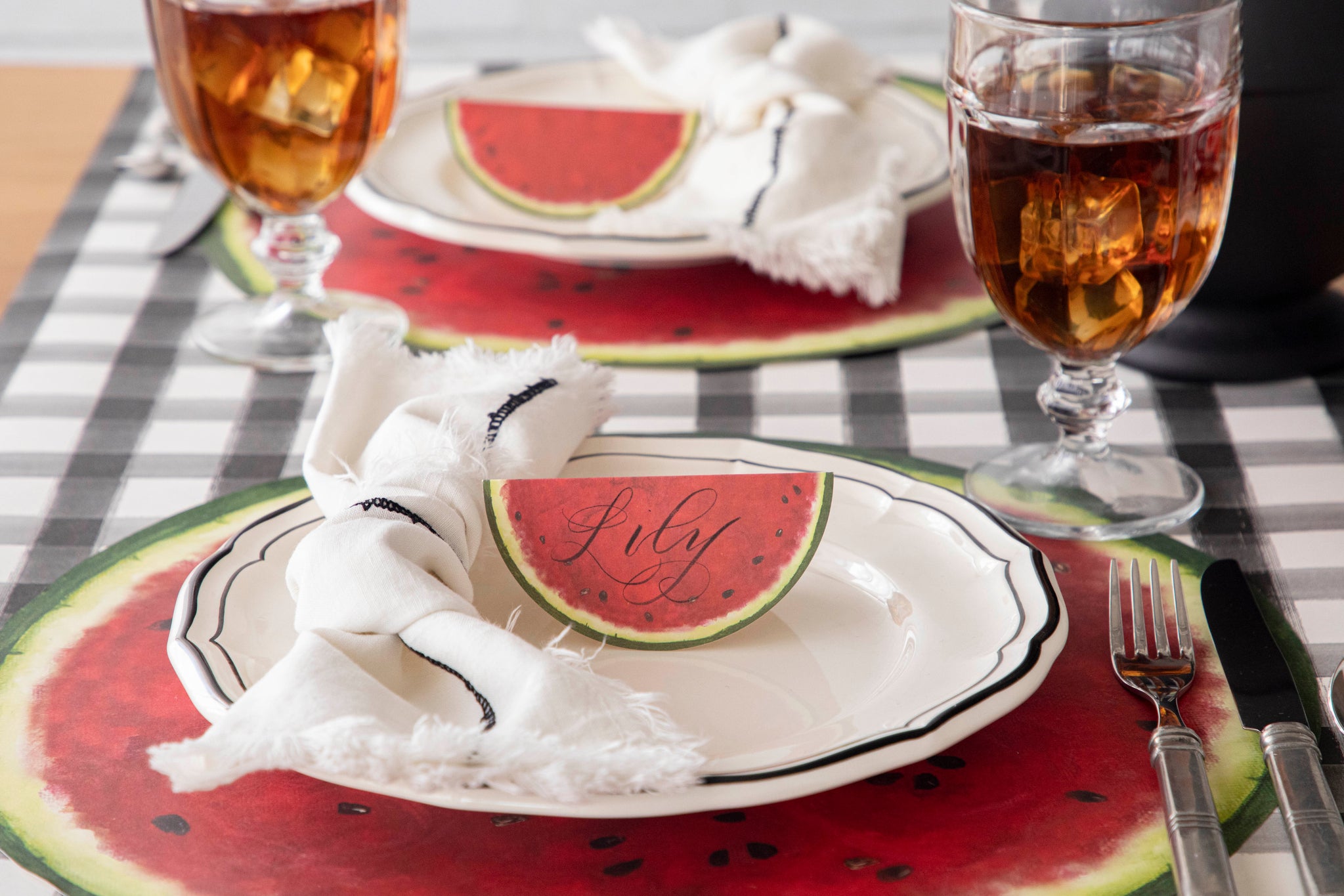 Die-cut Watermelon Placemat under a place setting for one.