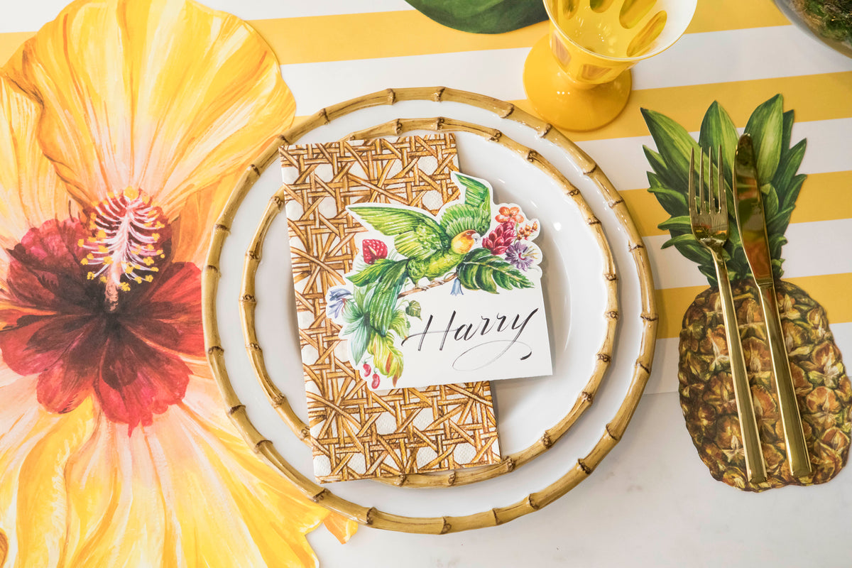 A tropical place setting featuring the Die-cut Hibiscus Placemat and Pink Lattice Runner.