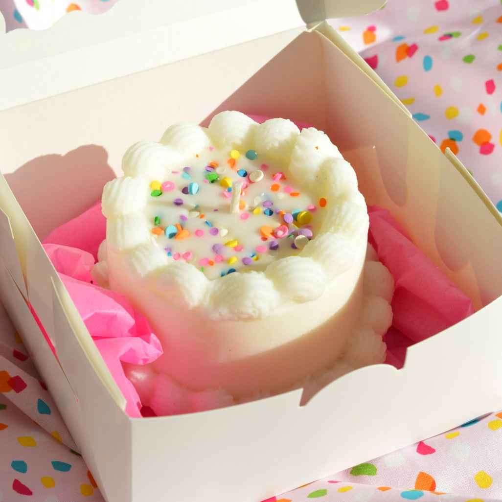 Birthday Cake shaped candle by Glow Worm Goods.