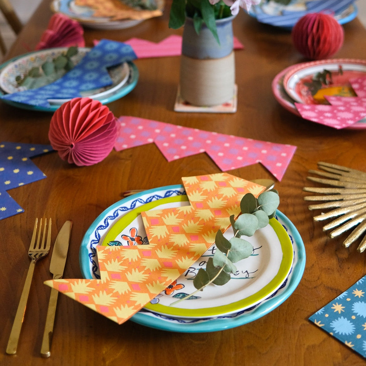 East End Press Paper Party Crowns in various colors on a table.