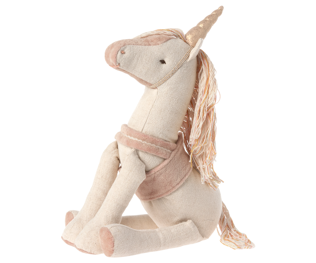 stuffed unicorn seated