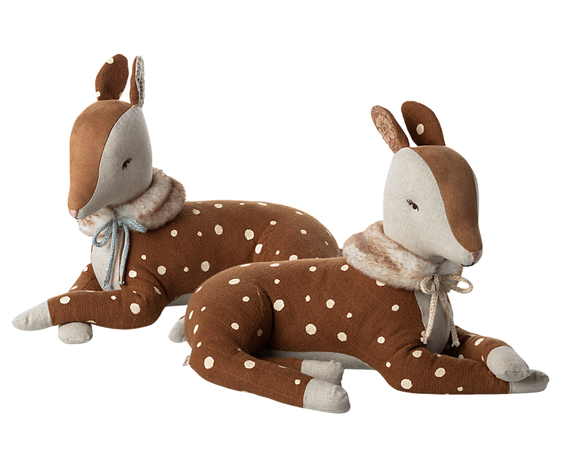 2 brown stuffed animal deer.  Both with faux fur scarves.  One deers scarf is tied with and off white ribbon the other with a blue ribbon