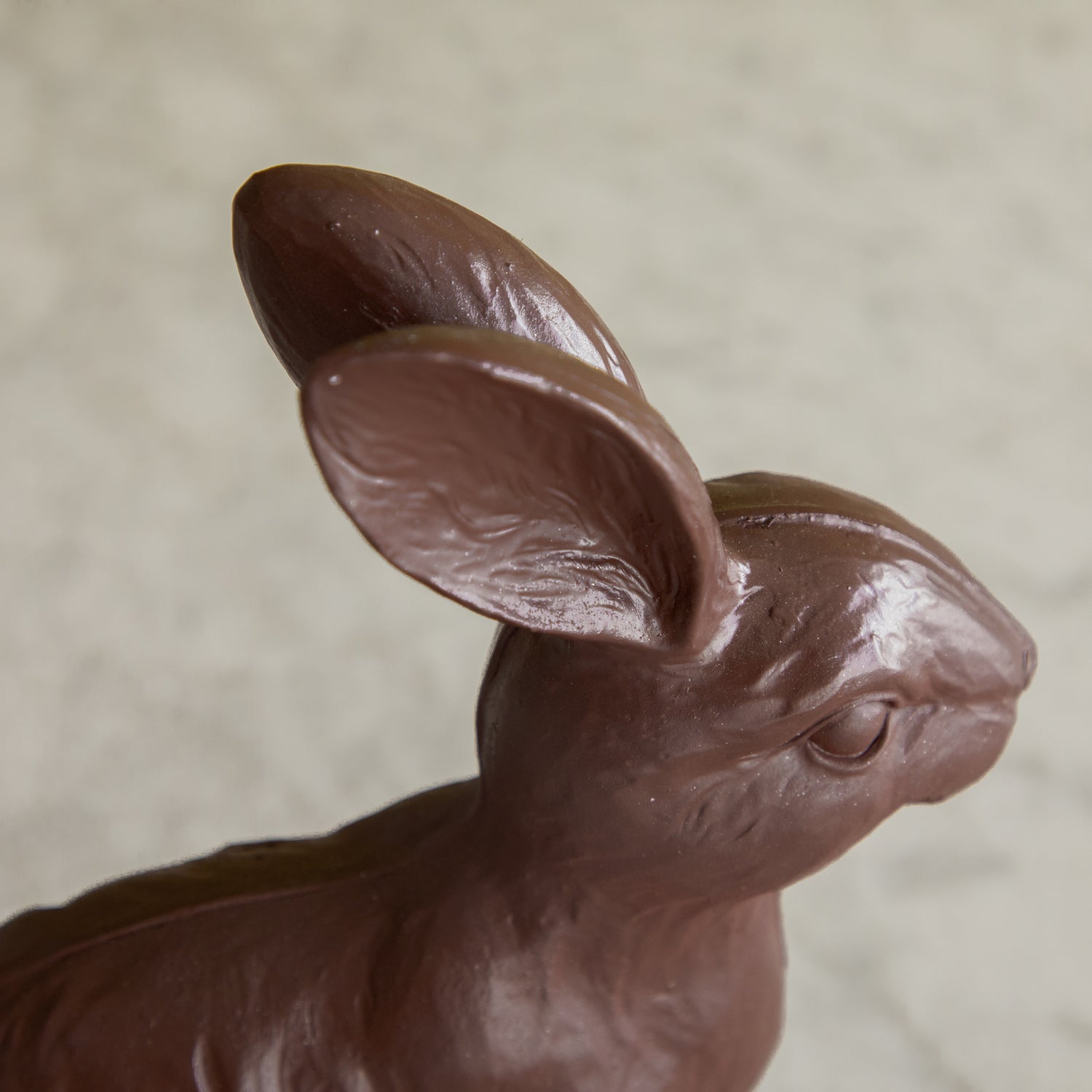 A close up of the &quot;Chocolate&quot; Sitting Bunny showing its detailed ears.