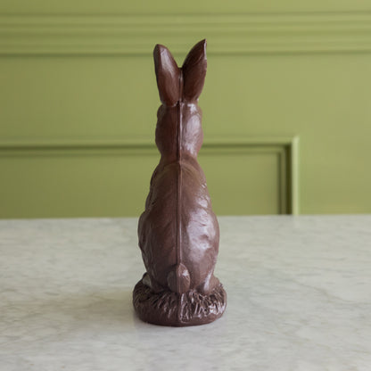 The back side of the &quot;Chocolate&quot; Sitting Bunny showing its tail.