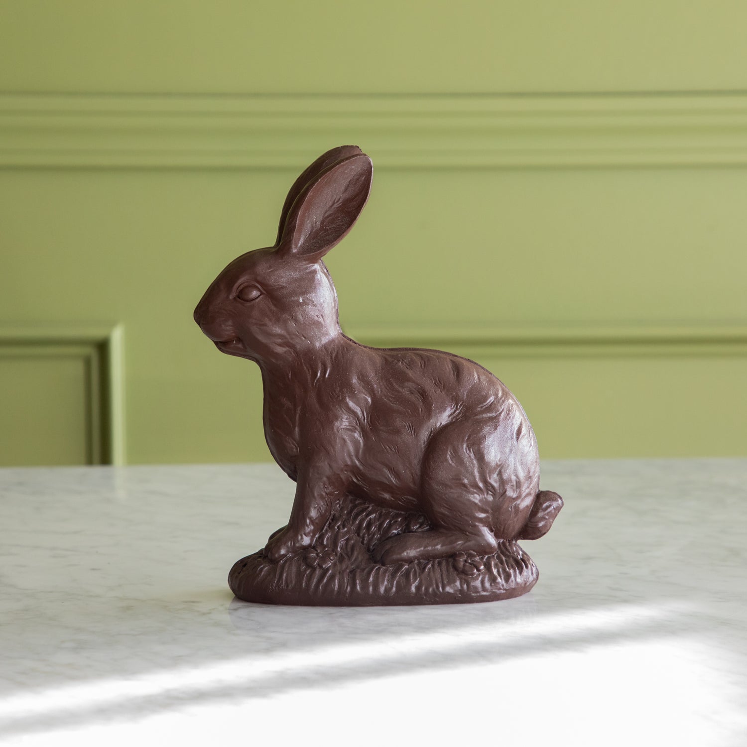 &quot;Chocolate&quot; Sitting Bunny facing to the side.