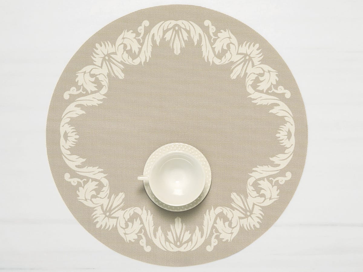 Scroll Round Placemat with teacup on it in Flax color