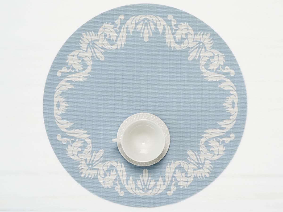 Scroll Round Placemat with teacup on it in Sea color