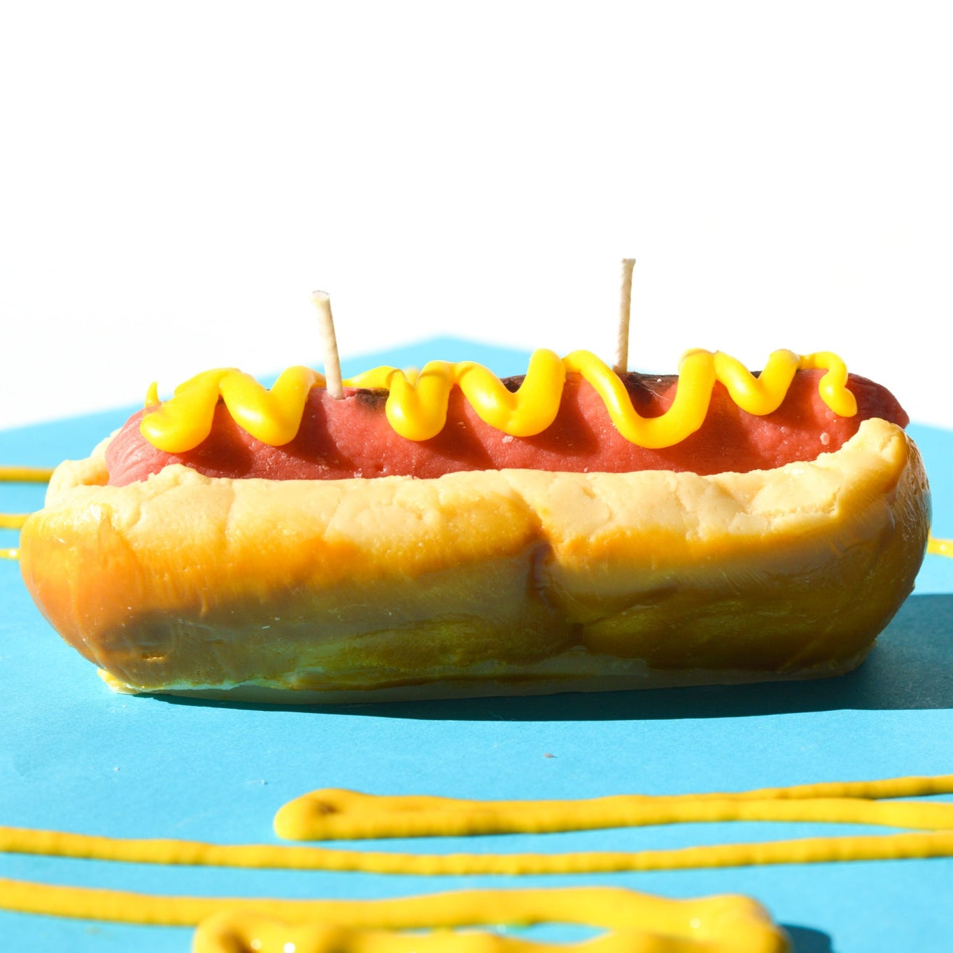 Hot dog shaped candle by Glow Worm Goods.