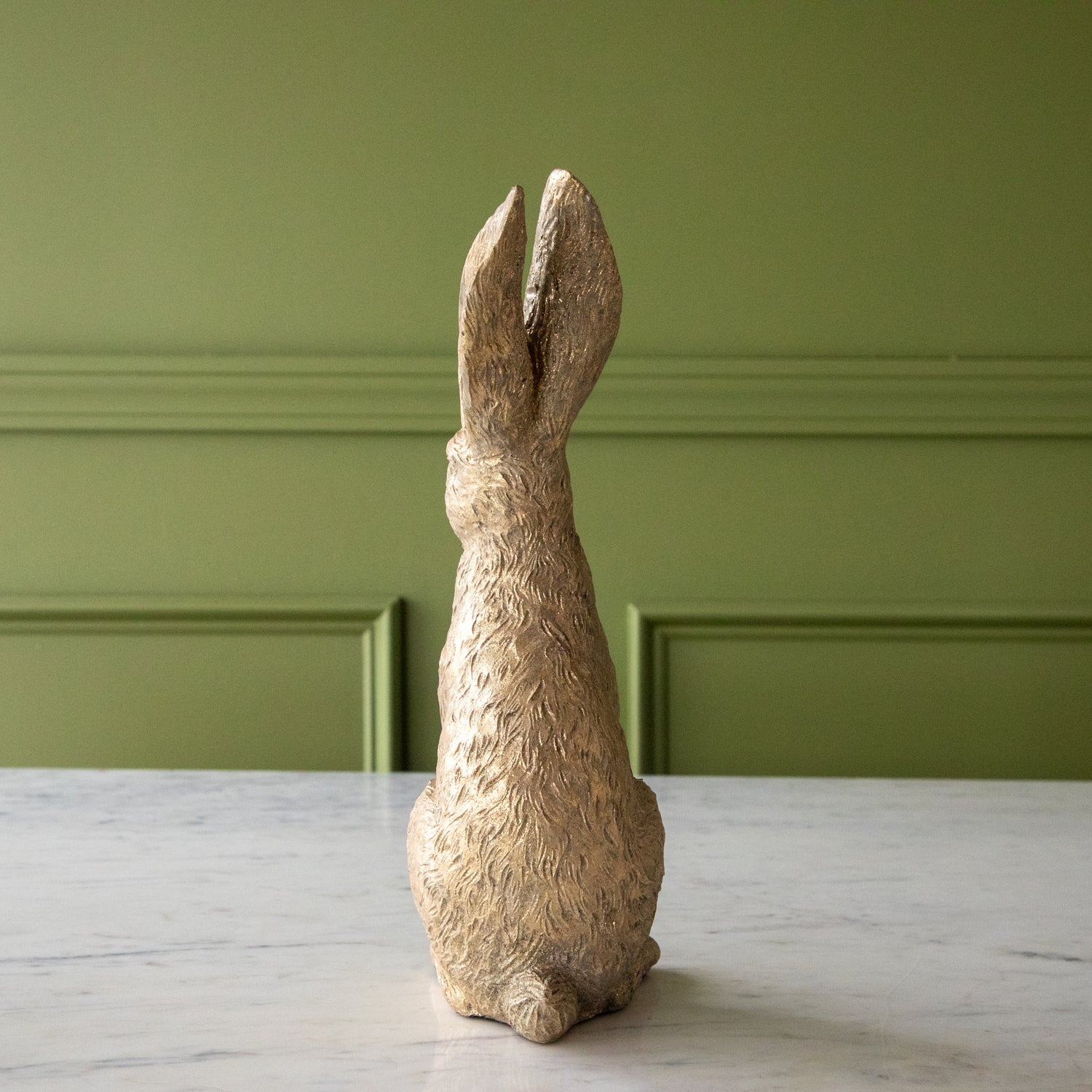 The back of the Head Up Gold Leaf Rabbit showing its tail.