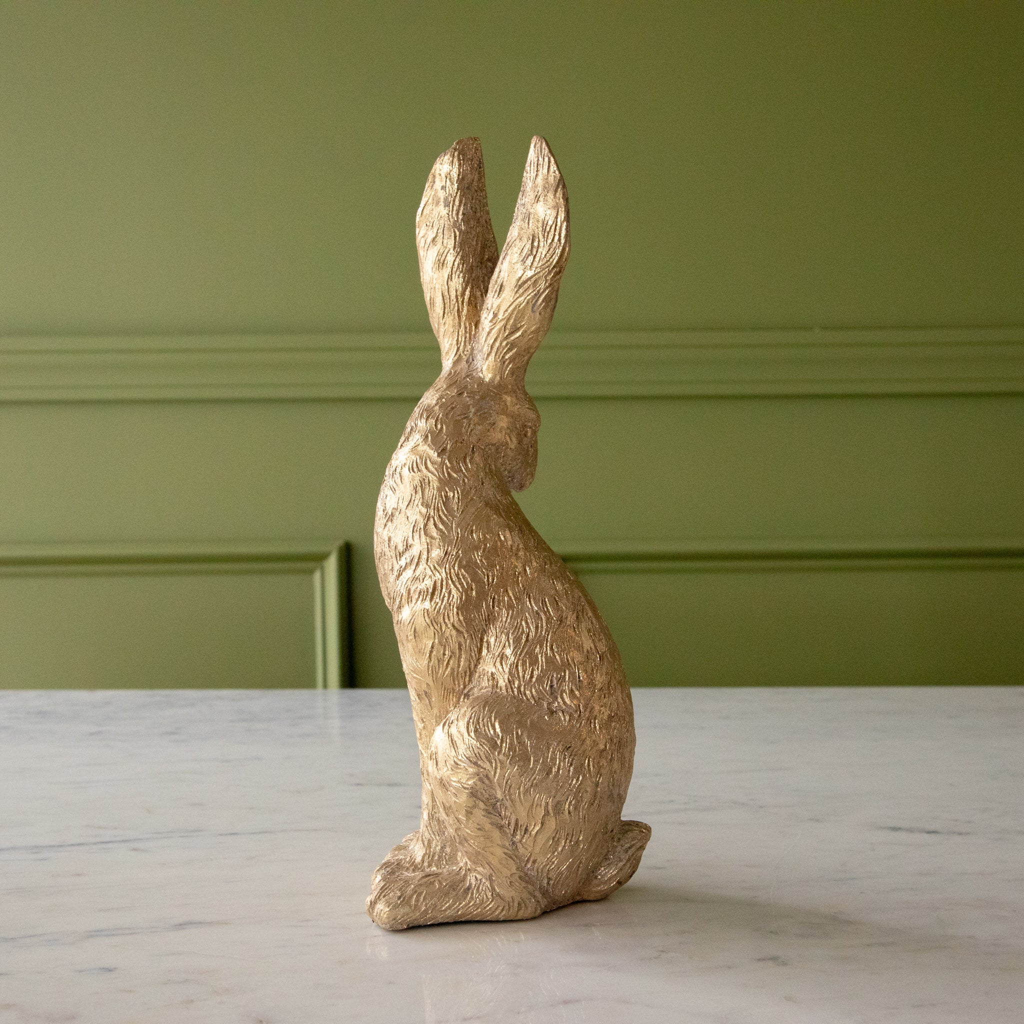 The side of the Head Down Gold Leaf Rabbit.