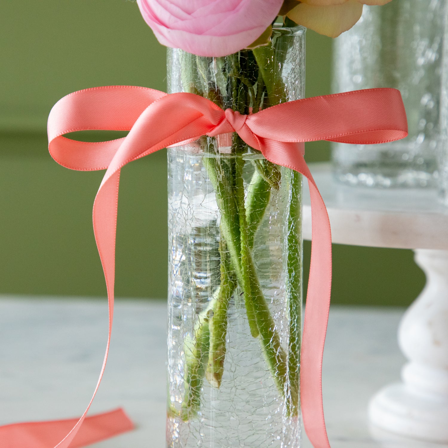 Norwell Champagne Flute filled with flowers and a pink bow tied around it.