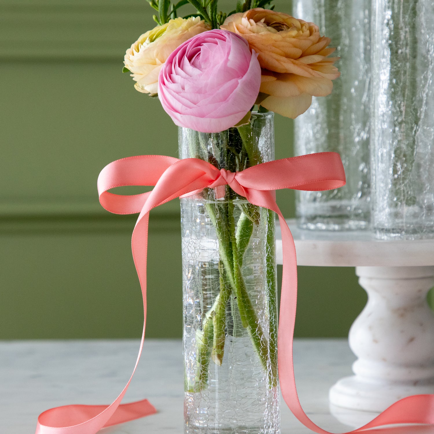 Norwell Champagne Flute filled with flowers and a pink bow tied around it.