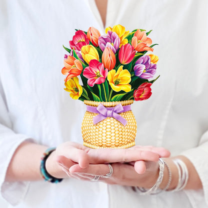 A woman holding the Mini Festive Tulips in her hands.