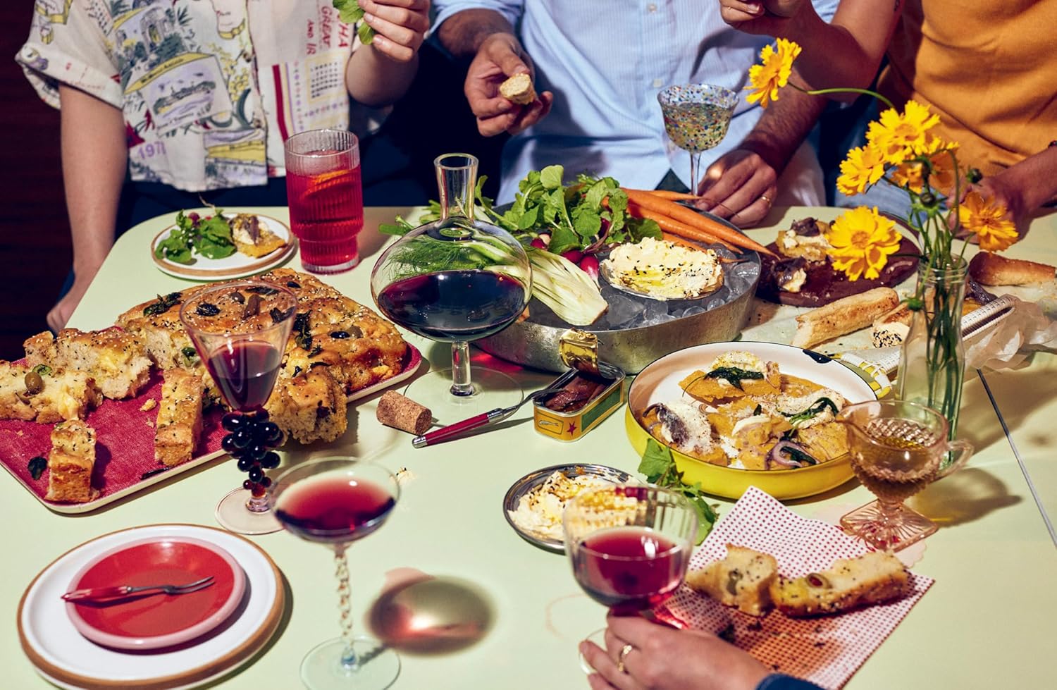 Food made from Happy Hour Snacks on a table with people around it