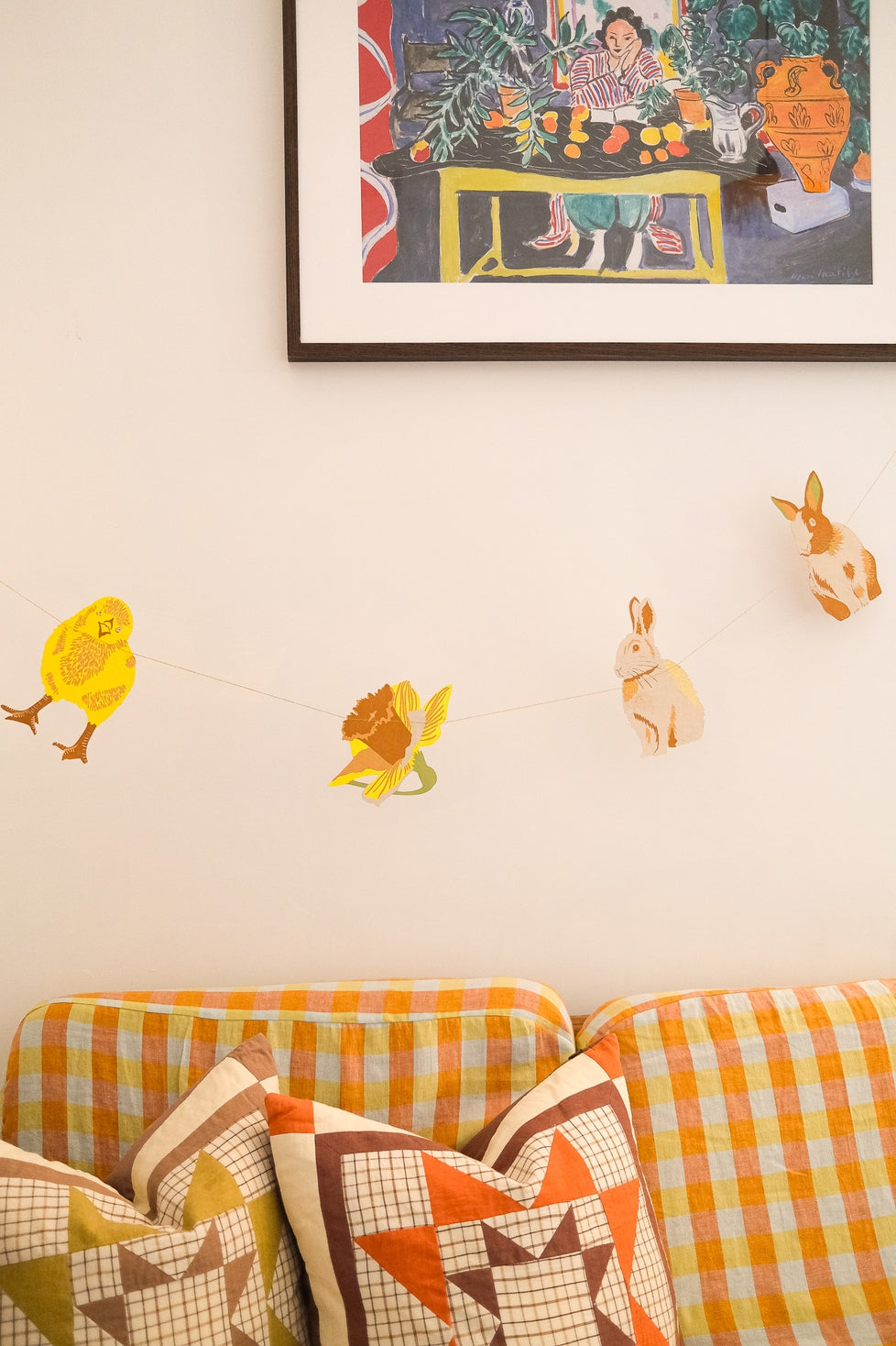 Rabbits Garland by East End Press hanging on a wall.