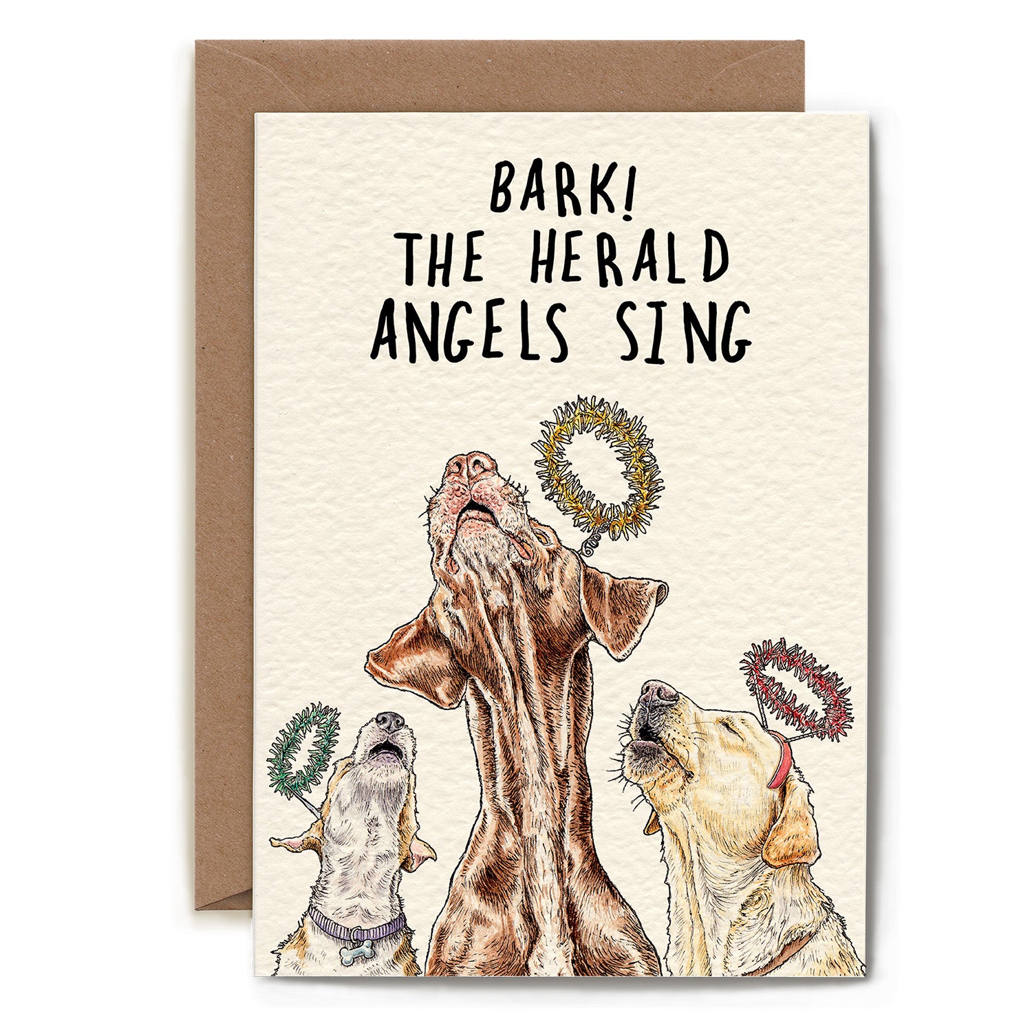 A whimsical greeting card featuring an illustrated trio of howling dogs wearing tinsel halos, captioned &quot;Bark! The Harald Angels Sing&quot;.