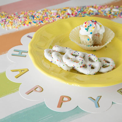 A Happy Birthday Serving Paper from Hester &amp; Cook, with a cupcake and pretzels on it, perfect for charcuterie spreads.