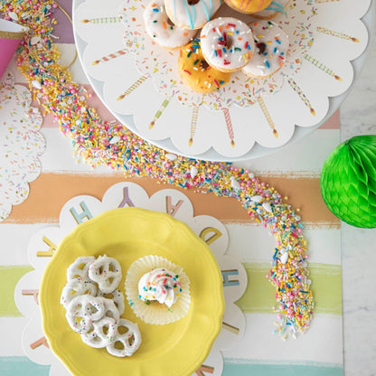 A plate of Happy Birthday Serving Papers on a Hester &amp; Cook cake stand.