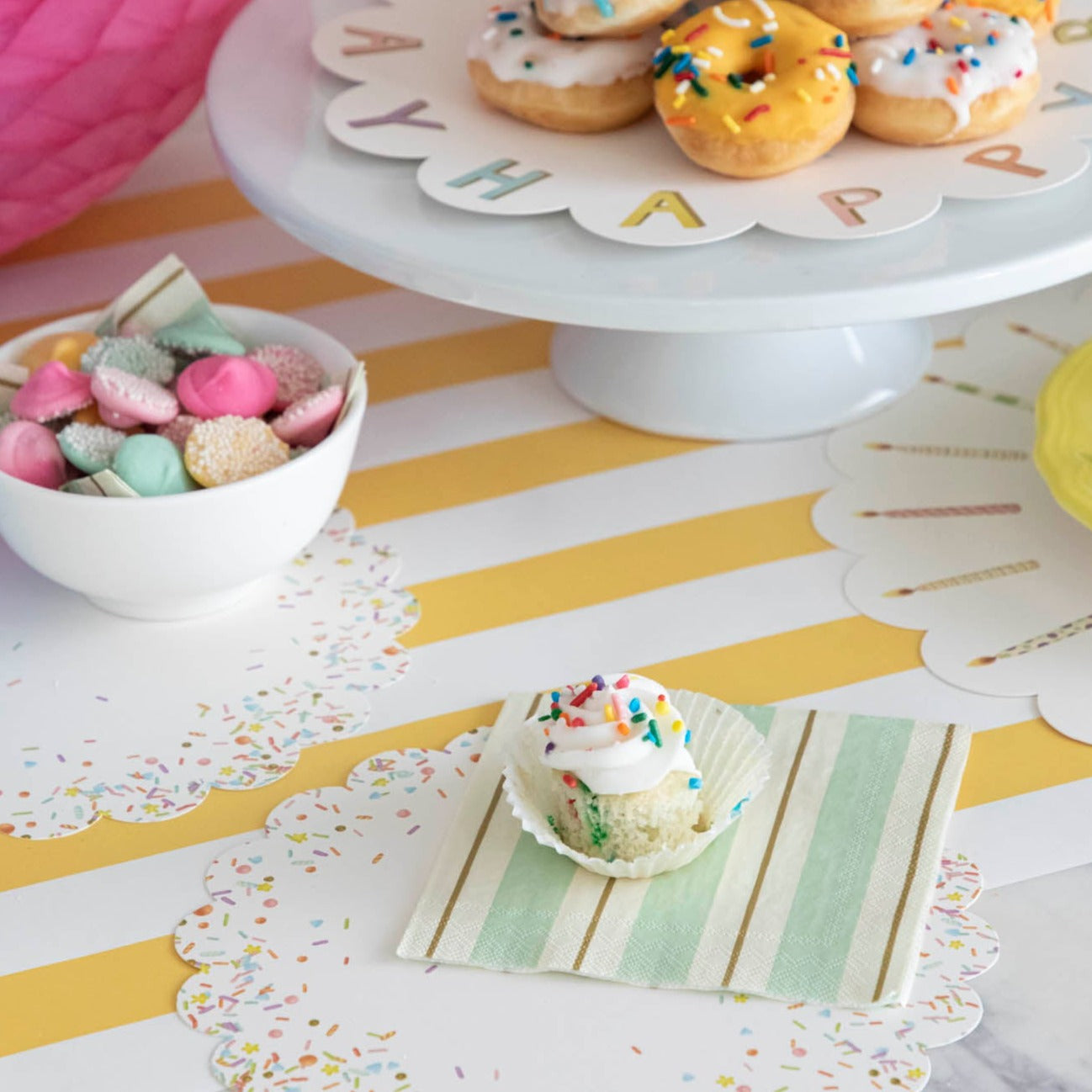 A plate of Happy Birthday Serving Papers from Hester &amp; Cook on a cake stand.