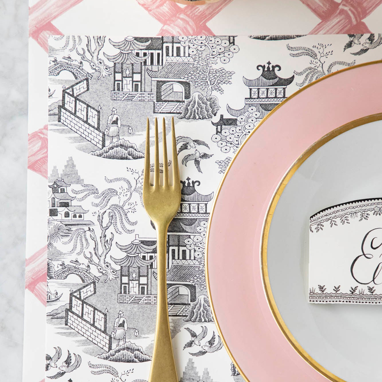 Black Willow Placemat on the Pink Lattice Runner, with an elegant place setting on top.