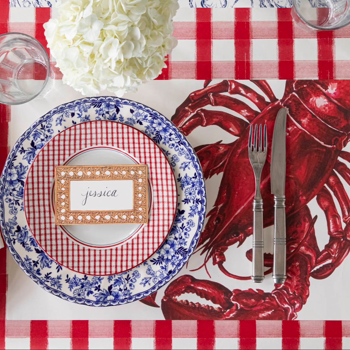 Rattan Weave Place Card with &quot;Jessica&quot; written on it, on a nautical themed table setting.