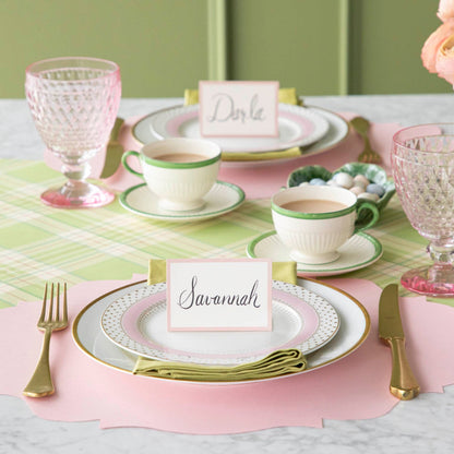 A colorful place setting with the Bright Green Plaid Runner under the Die-cut Pink French Frame Placemat and place setting.