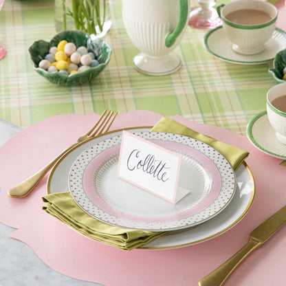 Pink Frame Place Card with &quot;Collette&quot; written in script, on a set of dinner plates on a colorful place setting.