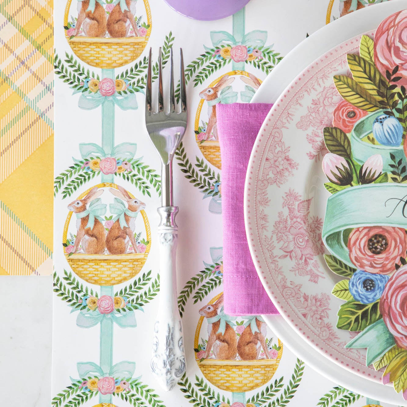 Laurel Bunny Baskets Placemat under a spring themed place setting.