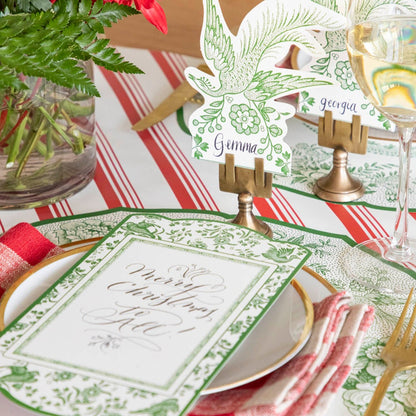 An elegant table setting featuring the Green Regal Peacock Table card paired with the Asiatic Pheasants Place Card in a Brass Place Card Holder.