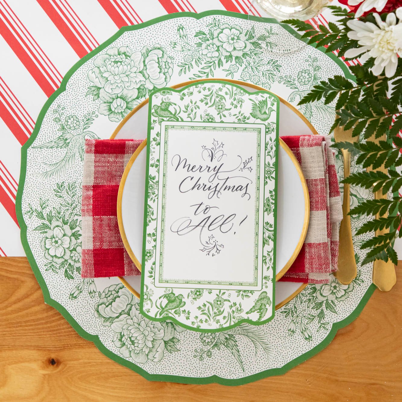 An elegant table setting featuring the Green Regal Peacock Table Card resting on dinner plates paired with the Die-cut Green Asiatic Pheasants Placemat.