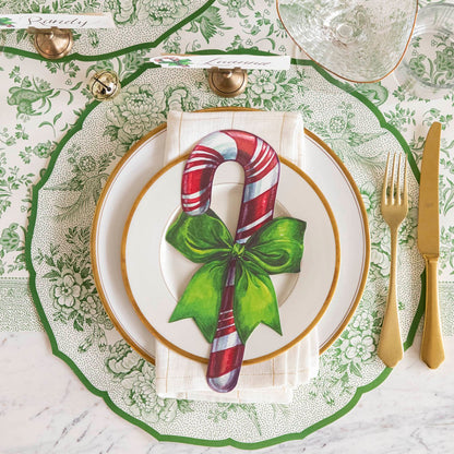 An elegant Christmas table setting featuring the Die-cut Green Asiatic Pheasants Placemat paired with the Candy Cane Table Accent.