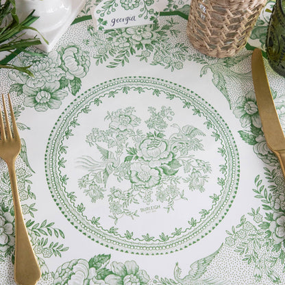 Close-up of the Die-cut Green Asiatic Pheasants Placemat in an elegant place setting, showing the artwork in detail.