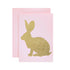 A light pink card featuring the silhouette of a rabbit in solid gold leaf.