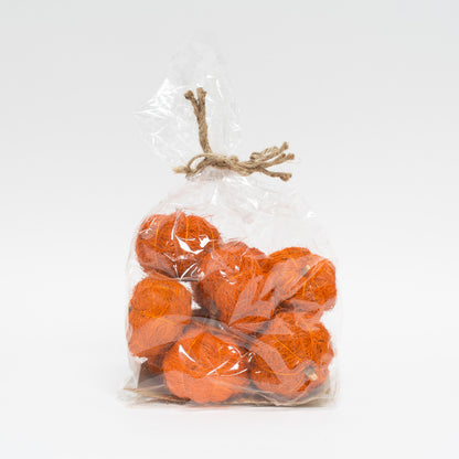 group of orange coco fiber pumpkins in cellophane bag