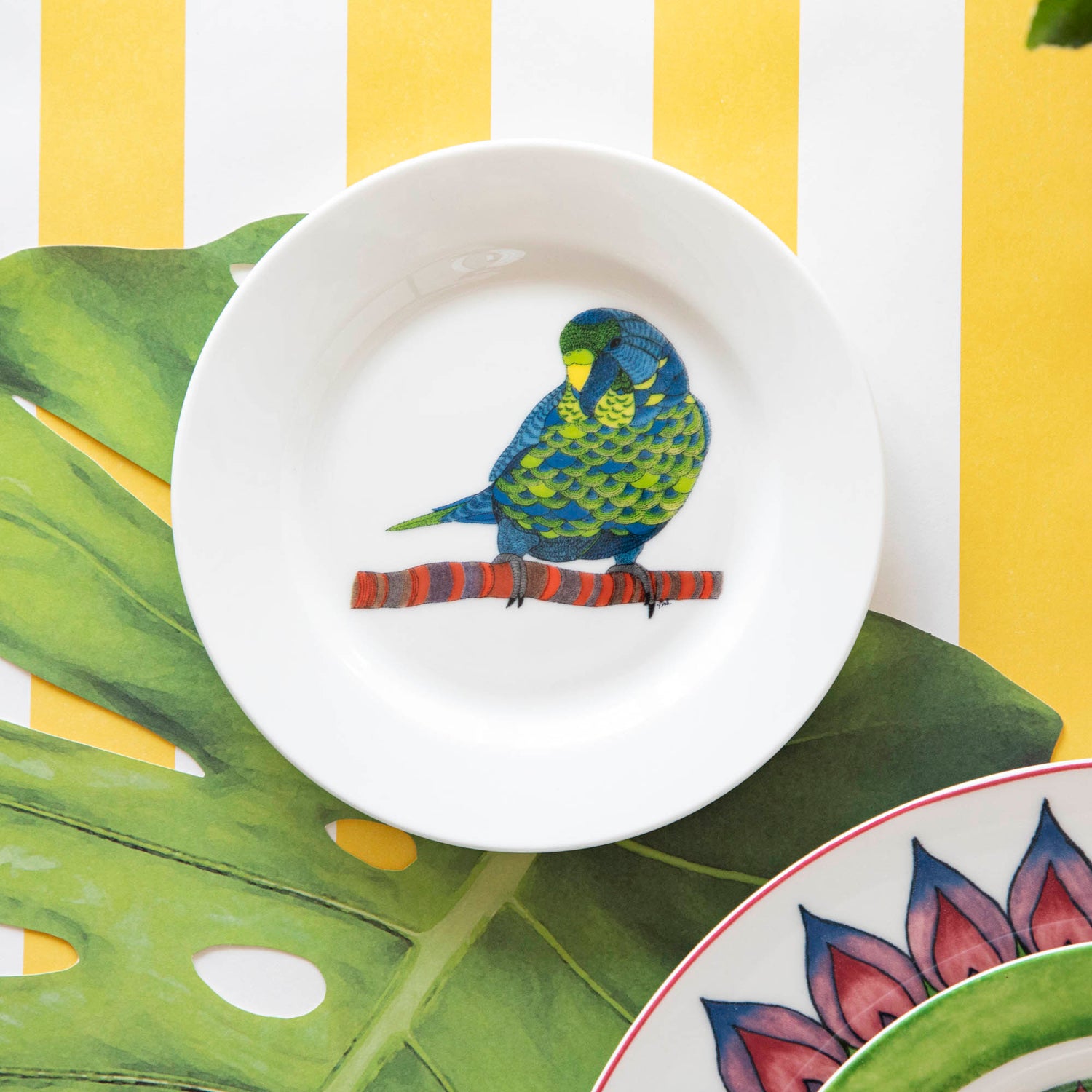 A plate with a bird on it from the Park Hill Calypso Dinnerware collection.