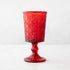 Red Pressed Goblet on a marble background.