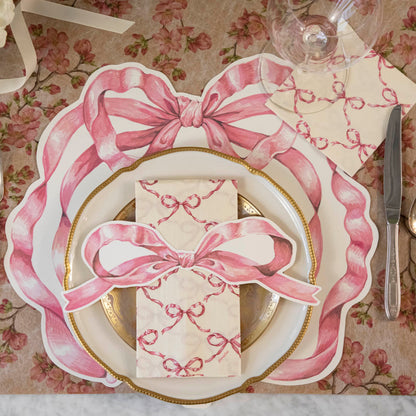 An elegant place setting with the Pink Bow Table Accent on the Pink Bow Guest Napkin, centered on the plates.