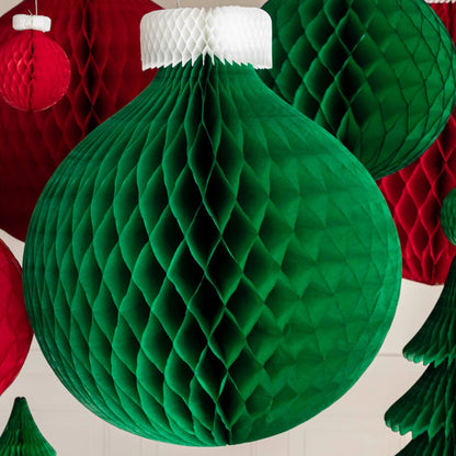 The green, Honeycomb Large Classic Ornament hanging in front of other various sized honeycomb classic ornaments.