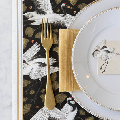 Crane Dance Placemat under an elegantly styled place setting for one.