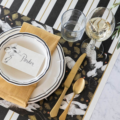 Crane Dance Placemat under an elegantly styled place setting for one.