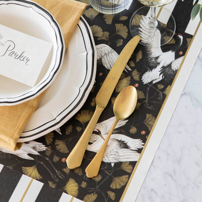 Crane Dance Placemat under an elegantly styled place setting for one.