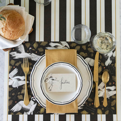 Crane Dance Placemat under an elegantly styled place setting for one.