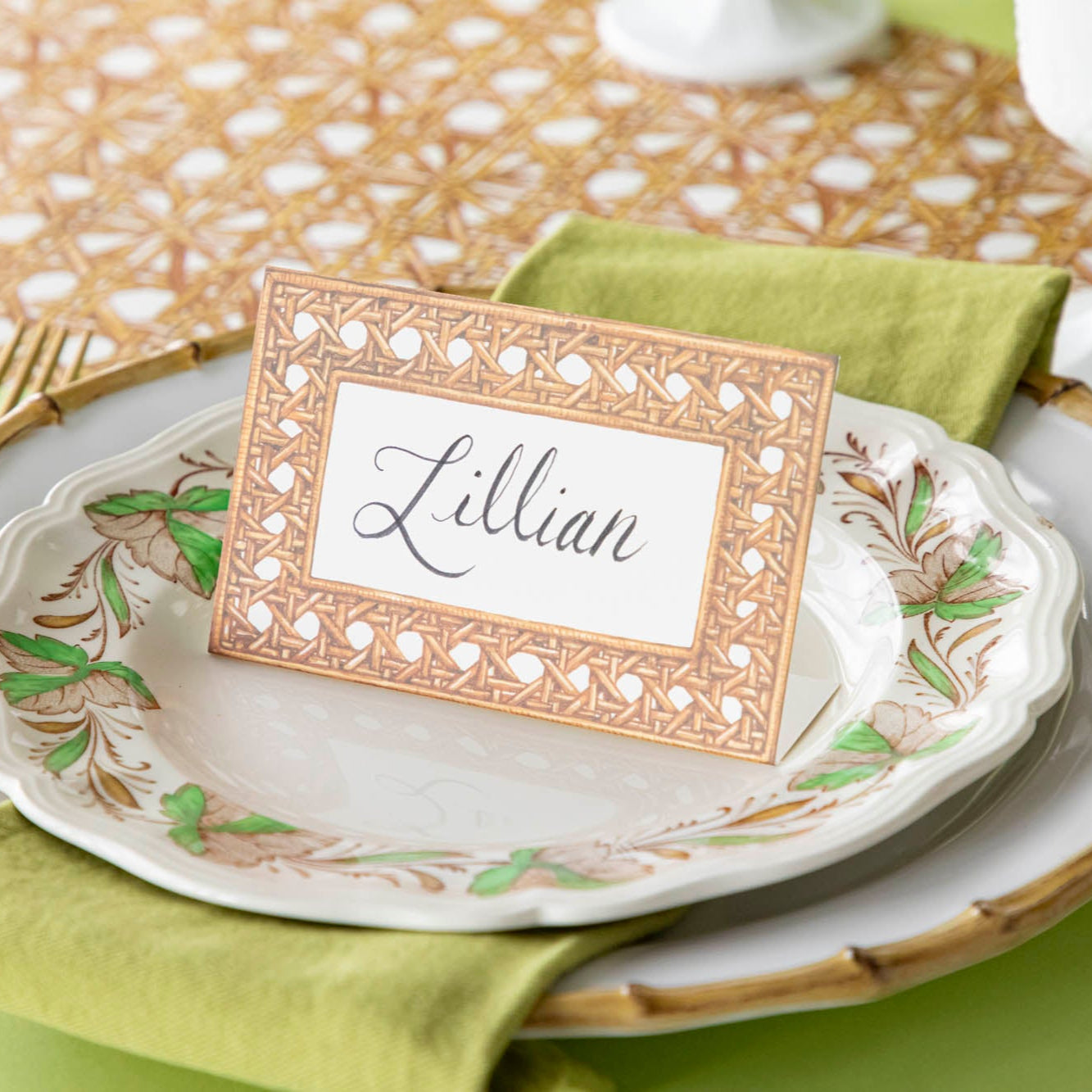 Rattan Weave Place Card with &quot;Lillian&quot; written on it, on a place setting for one.