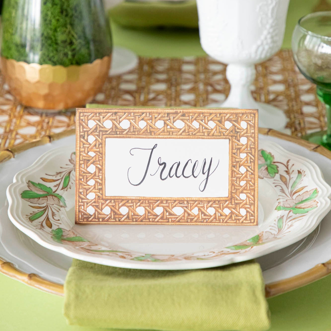 Rattan Weave Place Card with &quot;Tracey&quot; written on it, on a place setting for one.