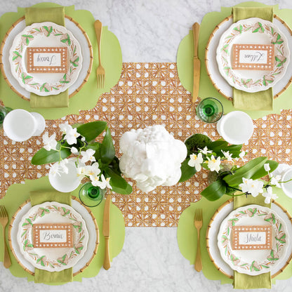 Rattan Weave Runner under an elegant place setting for four, with the Die-Cut Green French Frame Placemat on top.