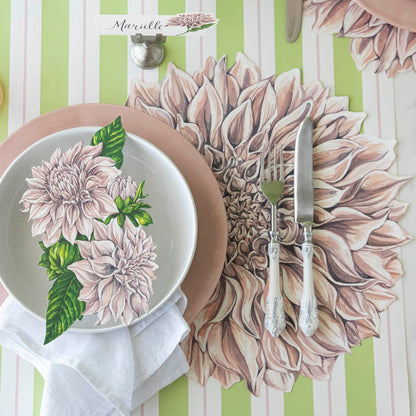 Die-cut Dahlia Placemat on the Green &amp; Pink Awning Stripe Runner, under a place setting for one.