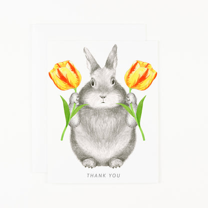 A Bunny with Tulips Card by Dear Hancock, featuring a bunny holding tulips, with a blank interior for your personal message.