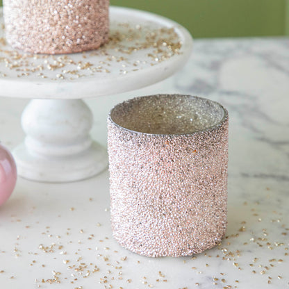 Pink Shimmer Votives surrounded by glitter.