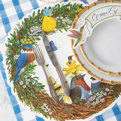 Songbird Wreath Placemat under a spring place setting.