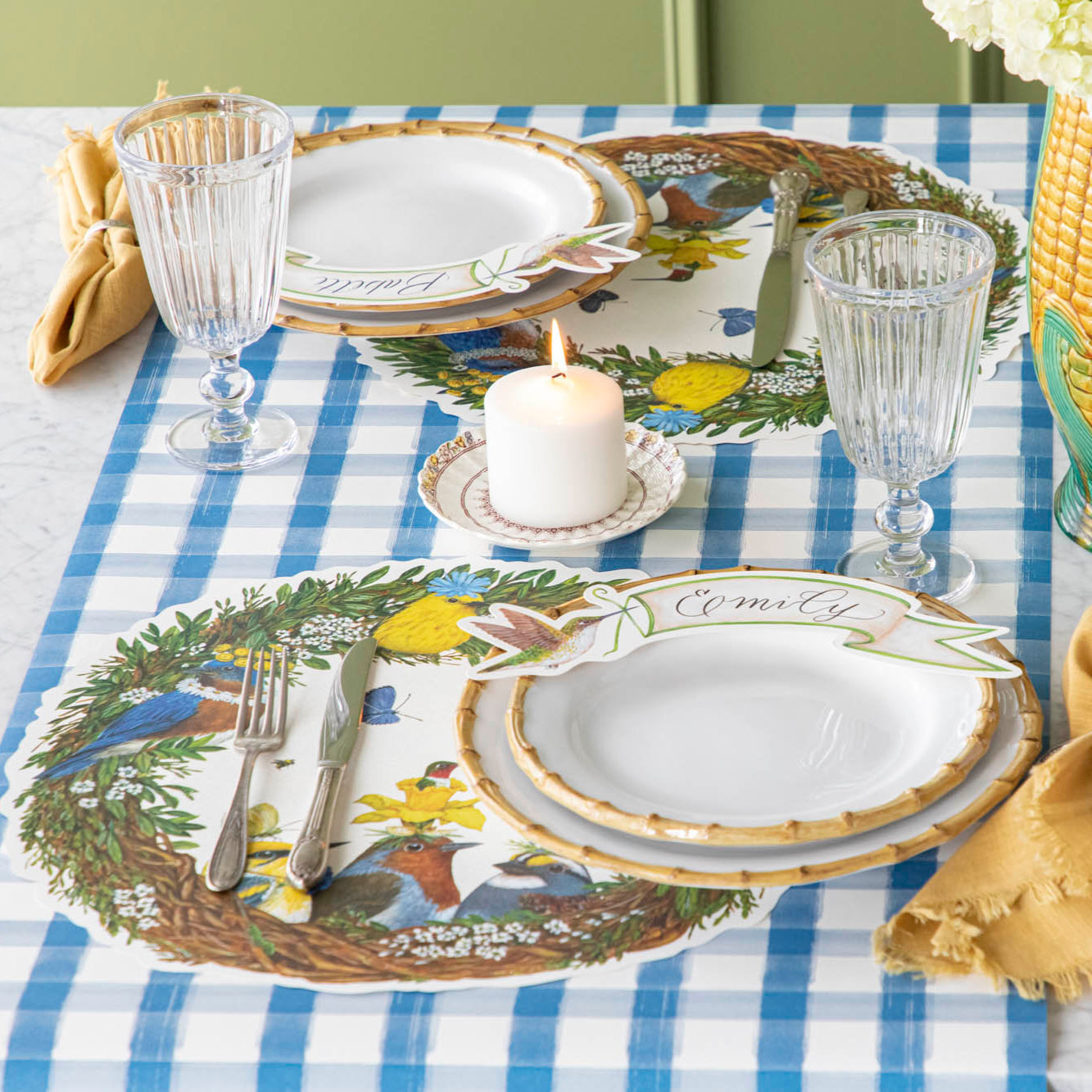 Songbird Wreath Placemat under a spring place setting.